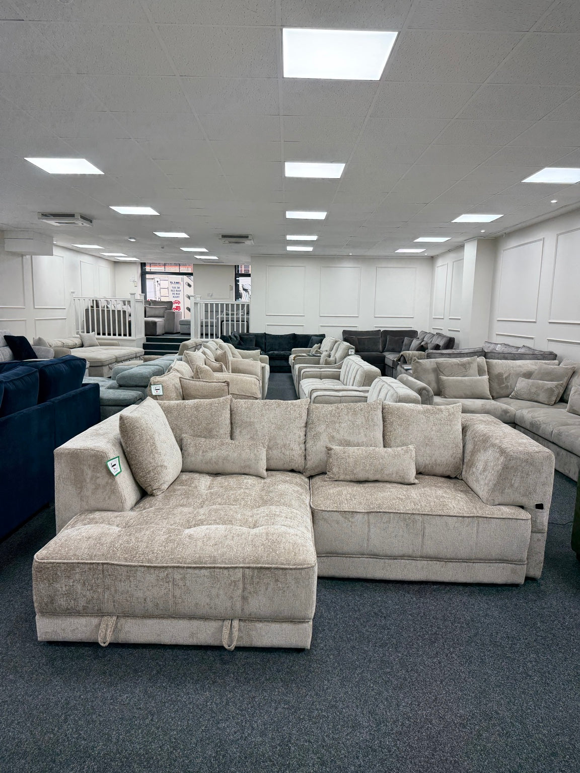Brooklyn Light Beige left-hand electric storage sofa bed, showroom front view