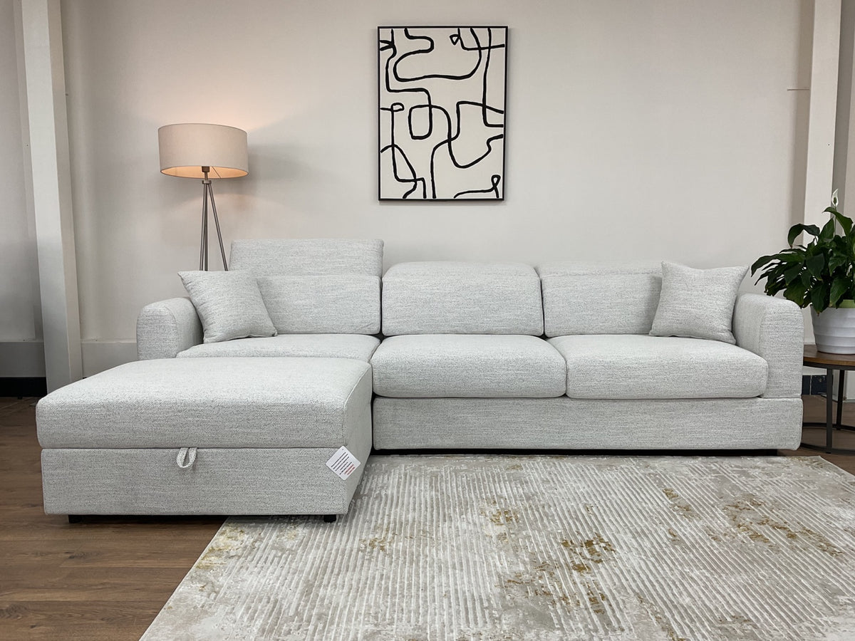 Front view of the Dexter beige corner sofa with headrests lowered