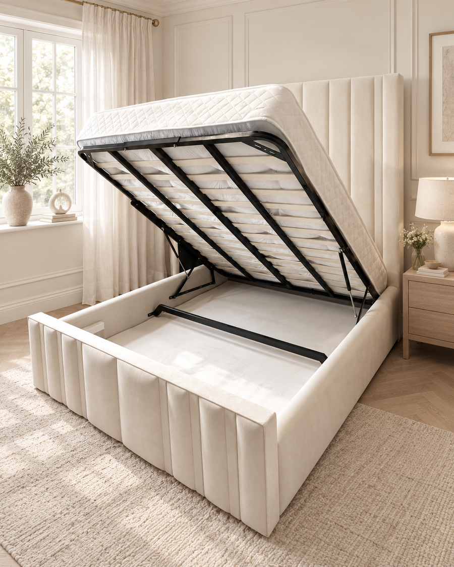 Cream ottoman storage bed with the lift mechanism open in a warm ivory bedroom