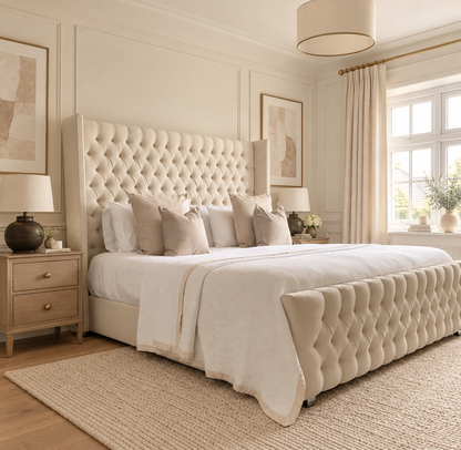 Polly Wing Buttoned Bed Frame, left low in a warm neutral bedroom