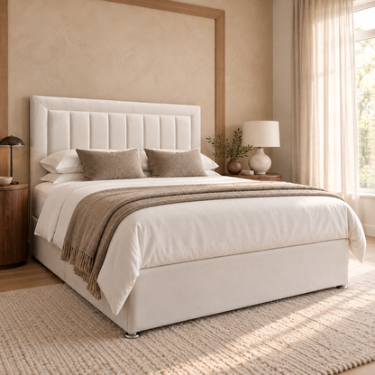 Montclair Divan Bed Frame, ivory upholstery and framed vertical-channel headboard, opposite three-quarter view. AI-generated product illustration.