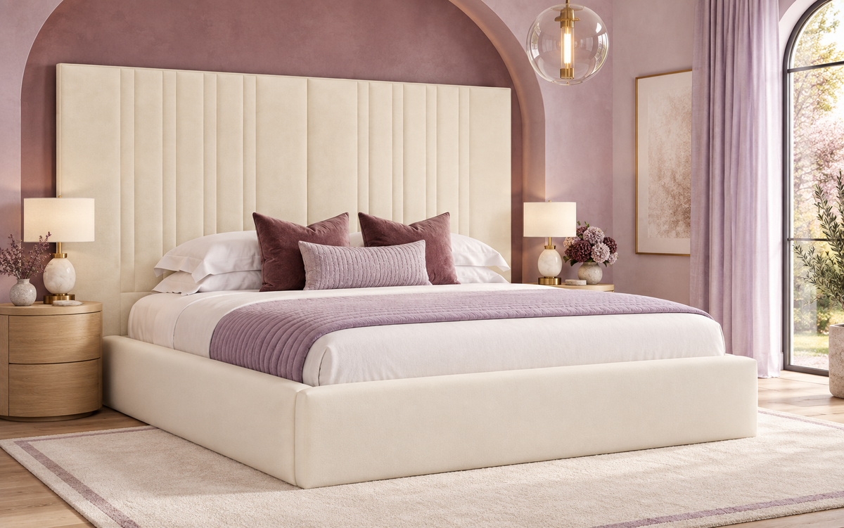 Cream Chateaux bed with its wide panelled headboard in a vibrant lilac and berry bedroom