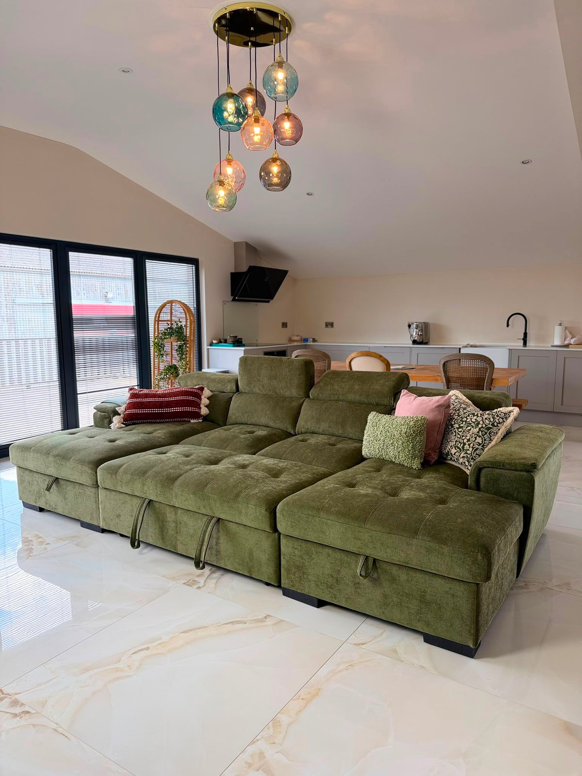 Green LoveMyBedss sofa in a customer home