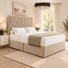 Solara Fan Divan Bed in champagne beige upholstery, three-quarter view, 54 inch headboard and closed optional drawers